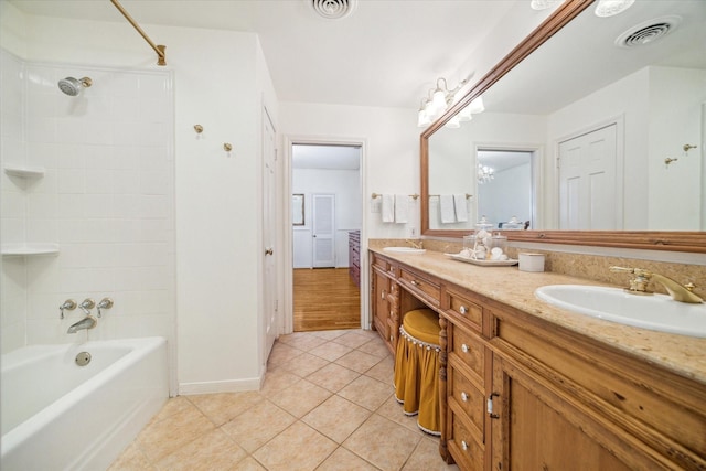 bathroom featuring tile patterned flooring, visible vents, and a sink