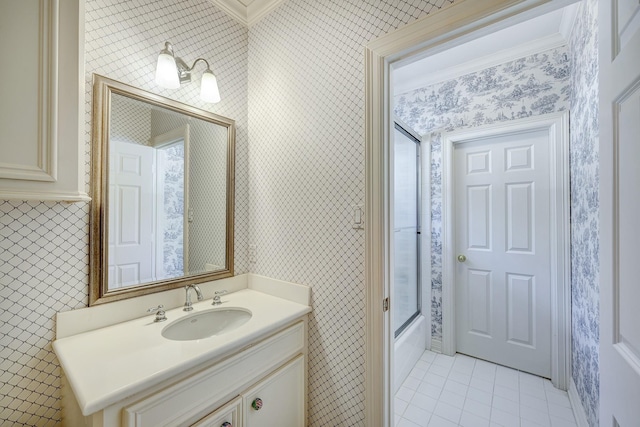 full bath featuring enclosed tub / shower combo, vanity, tile patterned flooring, and wallpapered walls