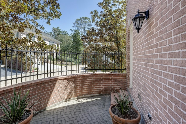 view of patio featuring fence