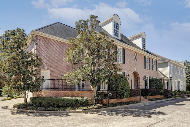 view of front of property featuring brick siding