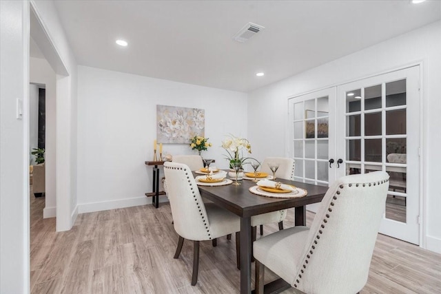 dining room with recessed lighting, light wood-style floors, visible vents, and baseboards