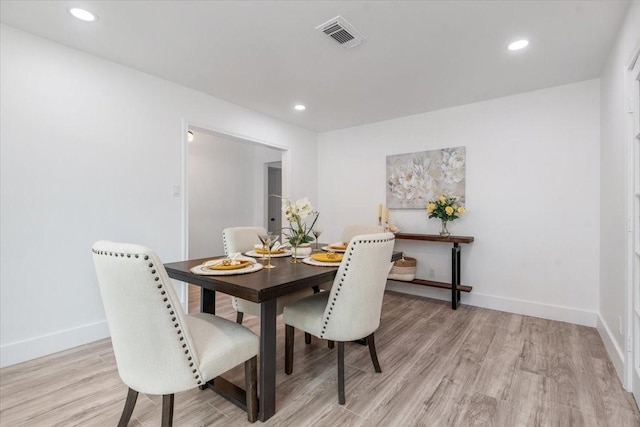 dining room featuring recessed lighting, light wood-type flooring, baseboards, and visible vents