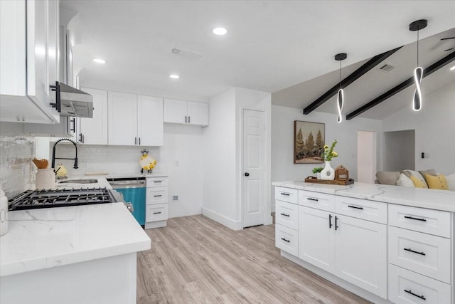 kitchen featuring visible vents, backsplash, white cabinetry, light wood-style floors, and dishwashing machine