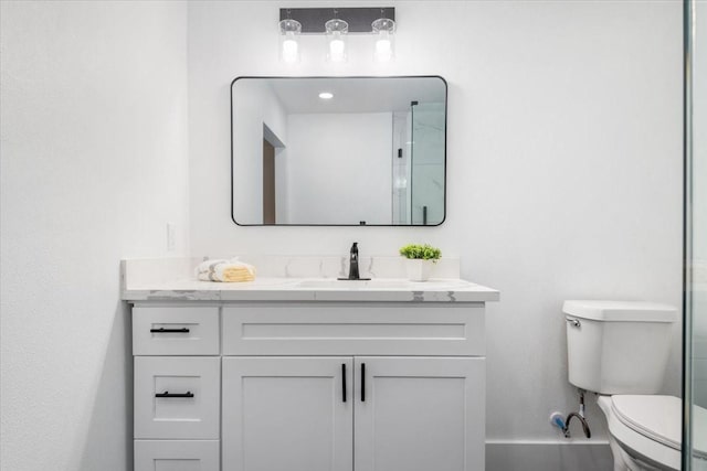 full bath featuring baseboards, toilet, and vanity