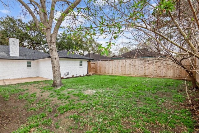 view of yard with a patio and a fenced backyard