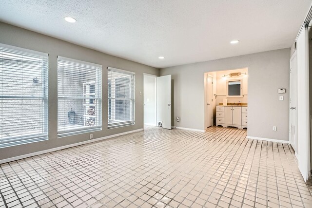 6008 Inwood Dr, Houston, TX 77057 - unfurnished living room featuring baseboards, plenty of natural light, and recessed lighting