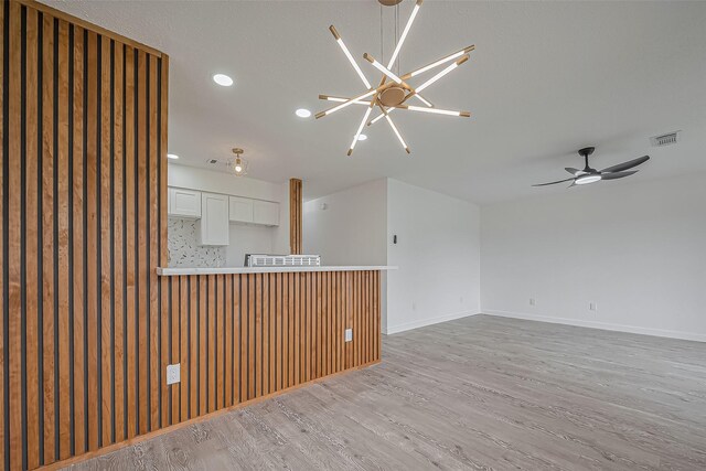 empty room with baseboards, visible vents, recessed lighting, ceiling fan, and light wood-type flooring