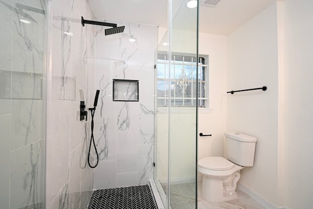 full bathroom featuring a marble finish shower, baseboards, toilet, and visible vents