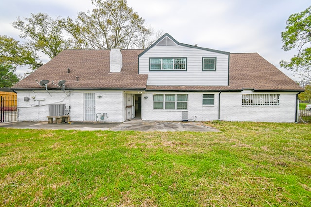 back of house with a yard, a patio, and fence