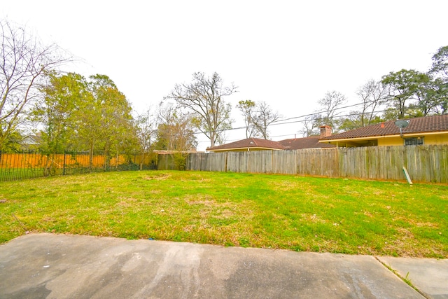 view of yard with a fenced backyard