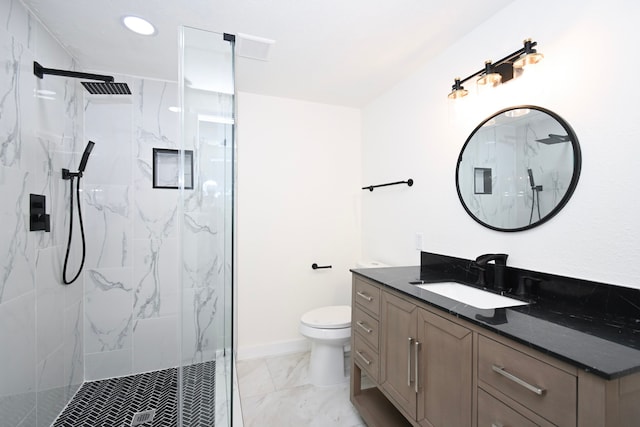 bathroom featuring vanity, toilet, marble finish floor, and a marble finish shower