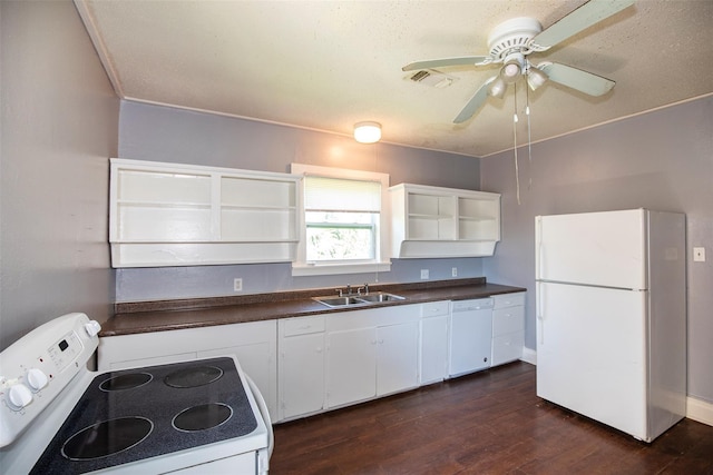 kitchen featuring open shelves, a sink, dark countertops, white appliances, and dark wood-style flooring