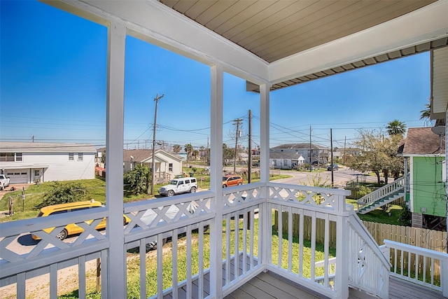 balcony with a residential view and a porch