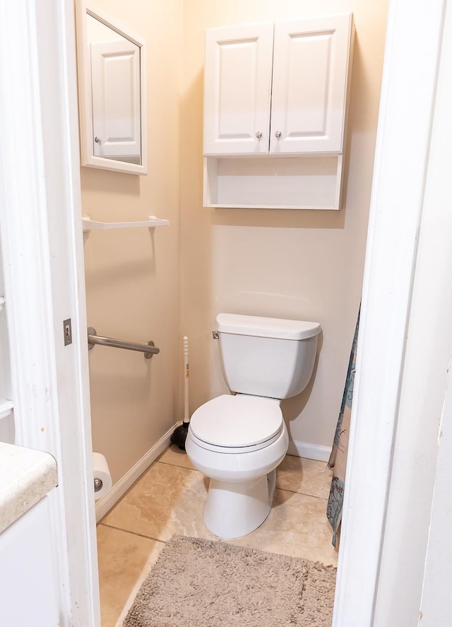 1922 Tabor St, Houston, TX 77009 - bathroom featuring baseboards, toilet, tile patterned flooring, and vanity