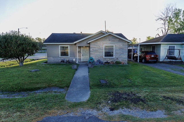 1922 Tabor St, Houston, TX 77009 - bungalow-style home with stone siding, a front yard, and asphalt driveway