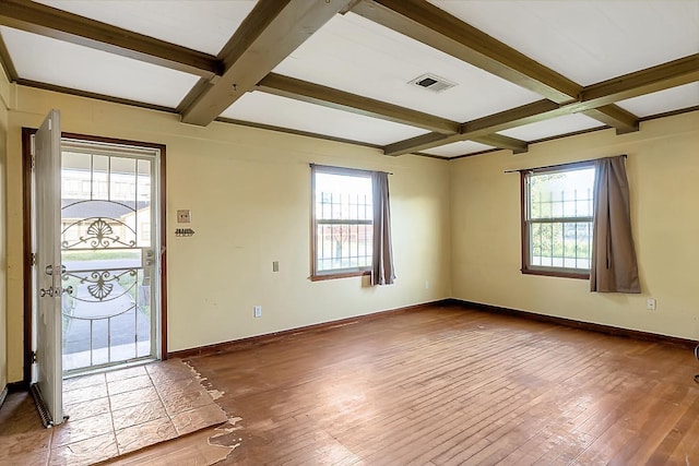 1922 Tabor St, Houston, TX 77009 - entrance foyer with coffered ceiling, healthy amount of natural light, beam ceiling, wood-type flooring, and baseboards