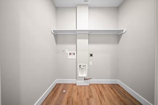 8120 Colonial Ln, Houston, TX 77051 - clothes washing area featuring hookup for a washing machine, baseboards, hookup for a gas dryer, and hookup for an electric dryer