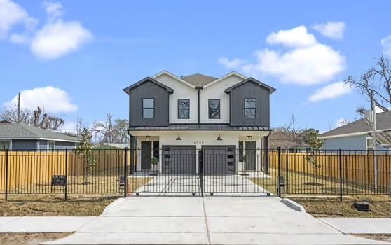 8120 Colonial Ln, Houston, TX 77051 - view of front of property with a fenced front yard, concrete driveway, and a gate