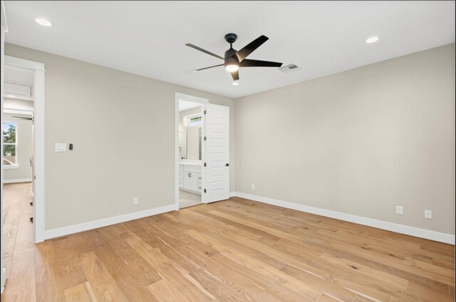unfurnished bedroom featuring visible vents, baseboards, and light wood finished floors