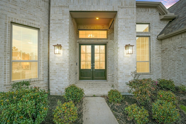 17366 Camillia Trl, Conroe, TX 77302 - exterior entry at dusk featuring brick siding