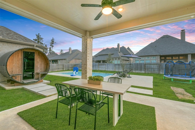17366 Camillia Trl, Conroe, TX 77302 - view of patio with a trampoline, a ceiling fan, and outdoor dining area