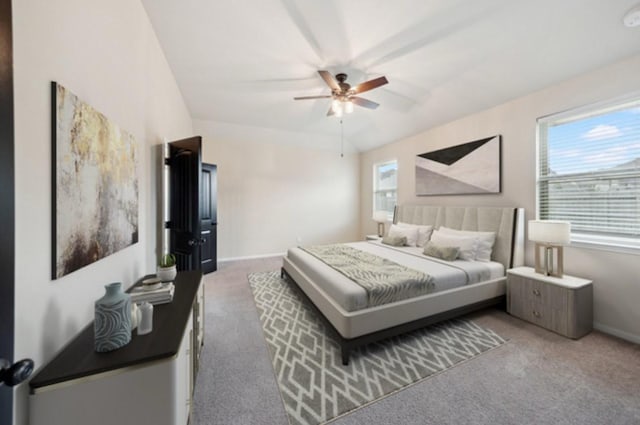 carpeted bedroom featuring multiple windows, baseboards, and ceiling fan