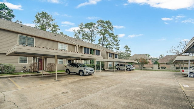 view of partially covered parking lot