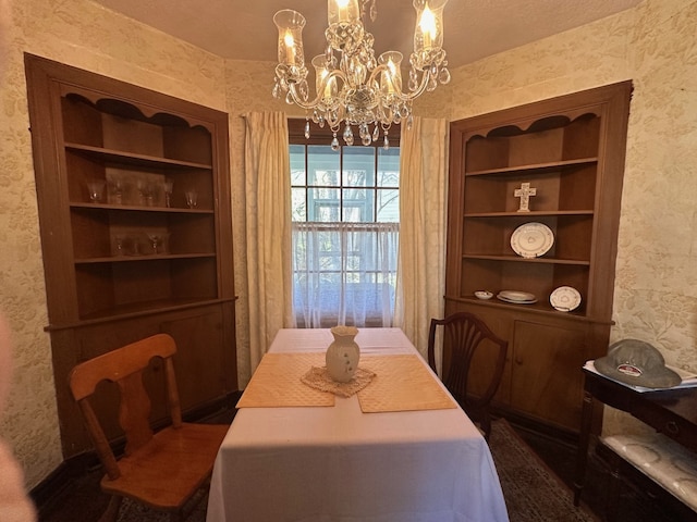 dining space featuring wallpapered walls and a notable chandelier