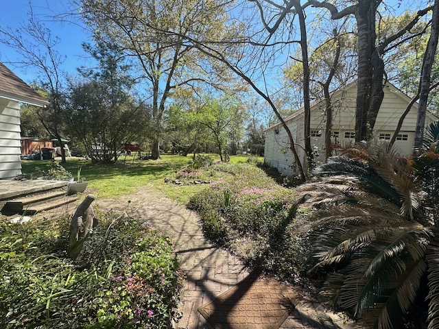 view of yard featuring a garage