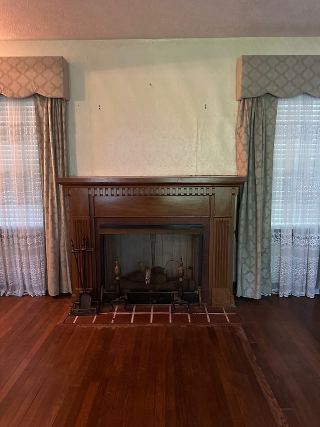 details with wood finished floors and a fireplace
