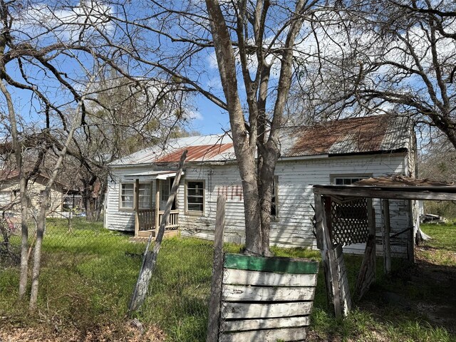 view of home's exterior with metal roof