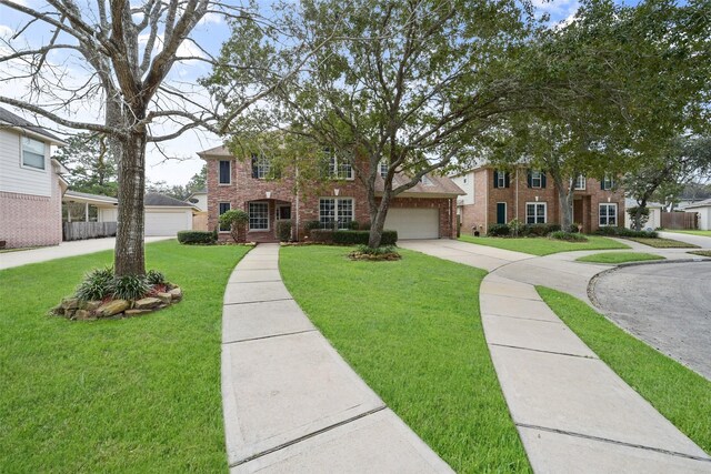 5310 Fairwick Ct, Katy, TX 77450 - view of front facade with brick siding, driveway, and a front lawn