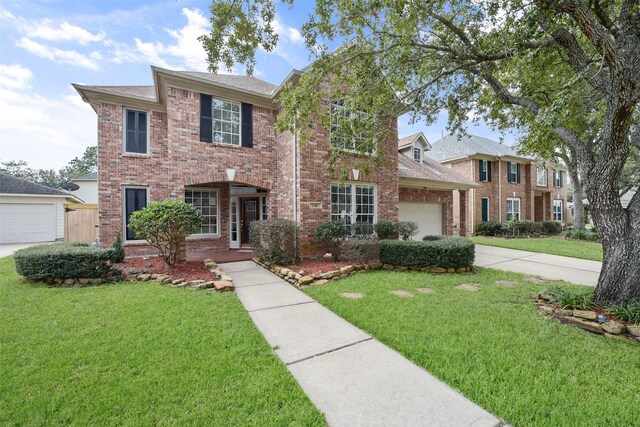 5310 Fairwick Ct, Katy, TX 77450 - view of front of property featuring concrete driveway, brick siding, a front yard, and a garage