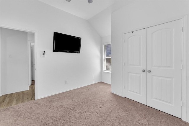 18406 Hilltop Climb Dr, Hockley, TX 77447 - unfurnished bedroom featuring carpet floors, a ceiling fan, baseboards, lofted ceiling, and a closet