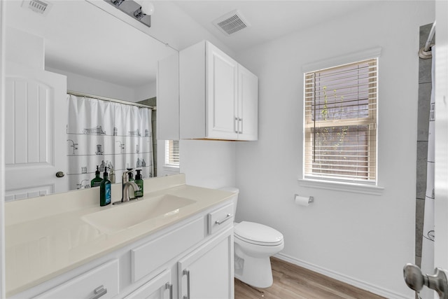 18406 Hilltop Climb Dr, Hockley, TX 77447 - full bath featuring visible vents, baseboards, wood finished floors, and toilet