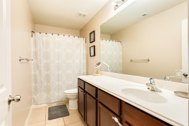 9411 Emerald Green Dr, Rosharon, TX 77583 - bathroom featuring vanity, tile patterned floors, toilet, and visible vents