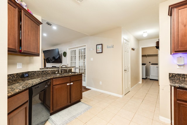 9411 Emerald Green Dr, Rosharon, TX 77583 - kitchen with light tile patterned floors, washing machine and clothes dryer, a sink, french doors, and dishwasher