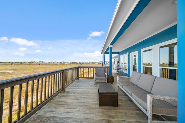23194 Camino St, Galveston, TX 77554 - wooden deck featuring an outdoor living space