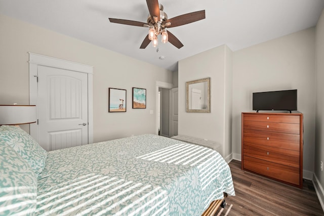 23194 Camino St, Galveston, TX 77554 - bedroom with baseboards, a ceiling fan, and wood finished floors