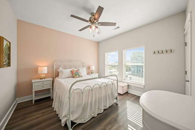 23194 Camino St, Galveston, TX 77554 - bedroom featuring visible vents, baseboards, ceiling fan, and dark wood-style floors