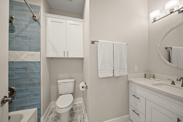 23194 Camino St, Galveston, TX 77554 - bathroom featuring vanity, baseboards, bathing tub / shower combination, tile patterned flooring, and toilet