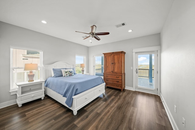 23194 Camino St, Galveston, TX 77554 - bedroom featuring dark wood finished floors, visible vents, access to exterior, multiple windows, and baseboards