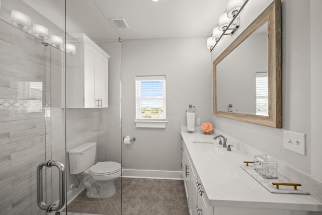 23194 Camino St, Galveston, TX 77554 - full bathroom with visible vents, toilet, a shower stall, vanity, and tile patterned flooring