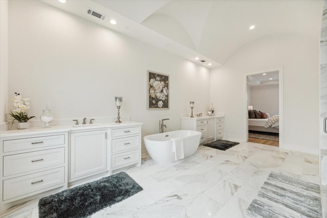 full bath with ensuite bathroom, visible vents, recessed lighting, lofted ceiling, and vanity