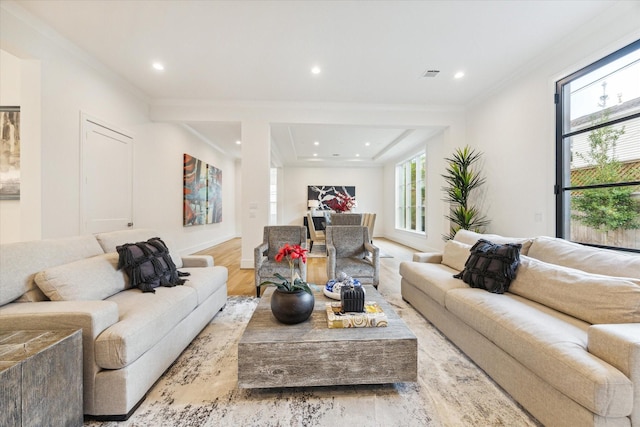 living room featuring ornamental molding, wood finished floors, visible vents, and recessed lighting