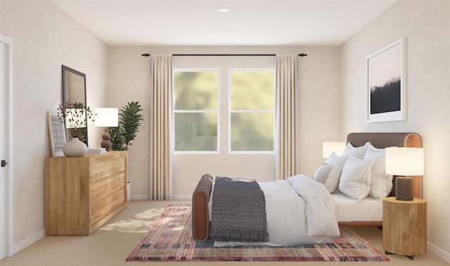 bedroom featuring carpet and baseboards