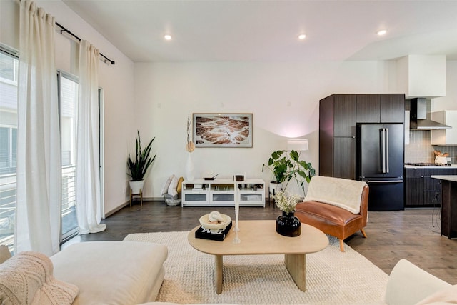 living area featuring recessed lighting, wood finished floors, and a wealth of natural light