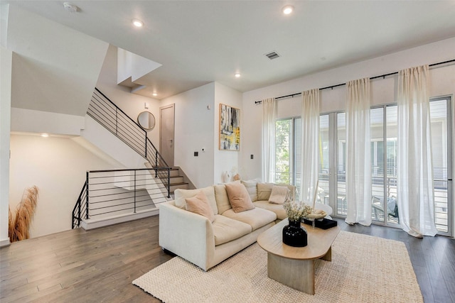 living room featuring stairway, recessed lighting, visible vents, and dark wood-style flooring