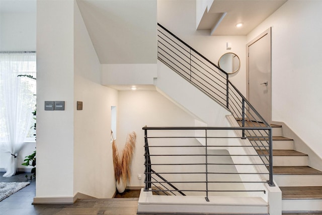 stairway with wood finished floors