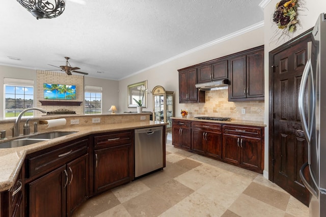 31810 Edgewater Dr, Magnolia, TX 77354 - kitchen featuring stainless steel appliances, a sink, a ceiling fan, decorative backsplash, and light stone countertops